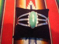 Native American Indian vintage sterling silver jewelry, and Navajo vintage sterling silver jewelry, a beautiful sterling silver bracelet with a wonderful turquoise stone and stampine, Arizona or New Mexico, c. 1940's. Main photo of the bracelet.