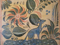 Closeup photo of Mexican tile with blue fox.