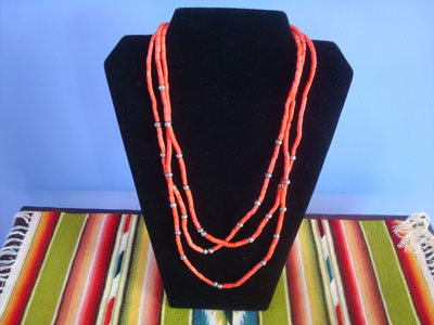 Native American Indian vintage silver jewelry, and Navajo vintage silver jewelry, a beautiful three-strand necklace of wonderful coral with silver beads, Navajo, Arizona or New Mexico, c. 1960's.