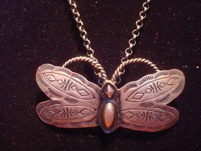 Native American Indian vintage sterling silver jewelry, and Navajo vintage sterling silver jewelry, a very beautiful Navajo silver butterfly pendant with very fine stamping on a wonderful silver chain, Arizona or New Mexico, c. 1960's. The silverwork is excellent and the pendant is graceful and beautiful! Closeup photo of the butterfly pendant.