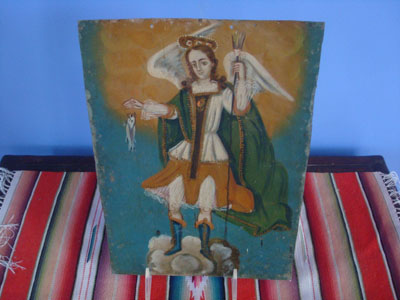 Mexican vintage devotional art. a retablo painted on tin depicting San Rafael the Archangel, Mexico, c. 1900.