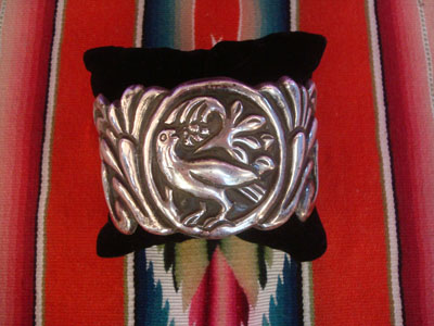 Mexican vintage sterling silver jewelry, and Taxco vintage silver jewelry, a beautiful repousse Taxco silver bracelet with incredible silverwork and beautiful designs, Taxco, c. 1940's.
