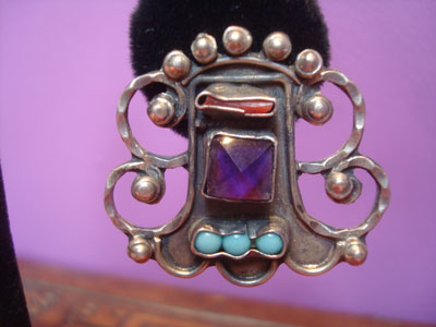 Mexican vintage sterling silver jewelry, and Taxco vintage sterling silver jewelry, a beautiful pair of Taxco silver earrings in the style of Matl, Taxco, c. 1980's. The earrings feature wonderful silver bump-outs, and amethyst, corral, and turquoise stones. Photo of one earring.