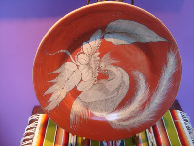 Mexican vintage pottery and ceramics, a beautiful pottery charger featuig a loveqly egret embracing the charger, Tonala, c. 1930's.