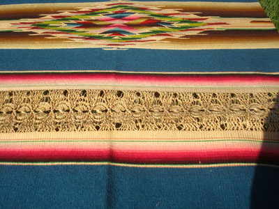 Mexican vintage textiles and Saltillo-style serapes (sarapes), a magnificent Saltillo-style serape runner, very finely woven and with lovely teneriffe (lacework) between the colorful bands of the textile, c. 1940's. This textile runner is a true work of art! Closeup photo showing the teneriffe lacework.