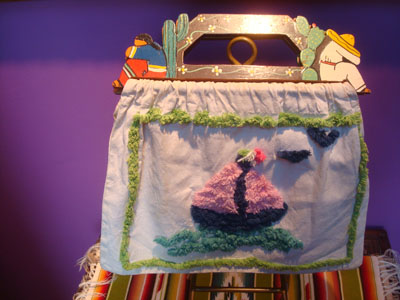 Mexican vintage folk art, a folk-art cotton/canvass bag with wonderful chenille designs and a carved wooden handle, c. 1950.