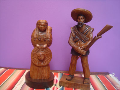 Mexican vintage woodcarvings and masks, a lovely woodcarving depicting a rvolutionary couple, Mexico, c. 1940's.
