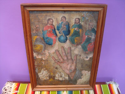 Mexican vintage devotional art, a retablo painted on tin depicting the bleeding Hand of God, c. 1880's (19th century).