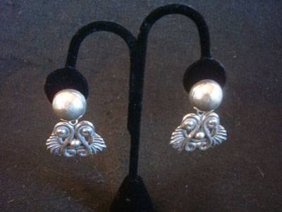 Mexican vintage sterling silver jewelry, and Taxco vintage sterling silver jewelry, a beautiful pair of repousee sterling silver earrings, Taxco, c. 1940's.