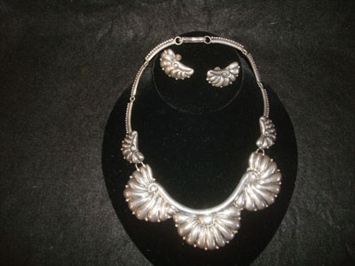 Mexican vintage sterling silver jewelry, and Taxco vintage sterling silver jewelry, a beautiful repousse sterling silver necklace and earrings set, Taxco, c. 1940's.