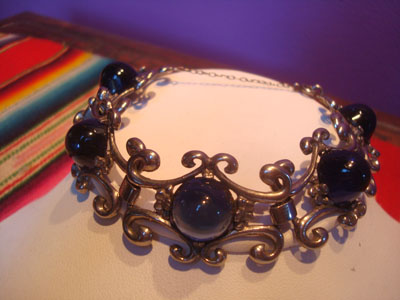 Mexican vintage sterling silver jewelry, and Taxco vintage sterling silver jewelry, a beautiful Taxco silver braccelet with cobalt blue glass half-spheres, Taxco, c. 1940's.