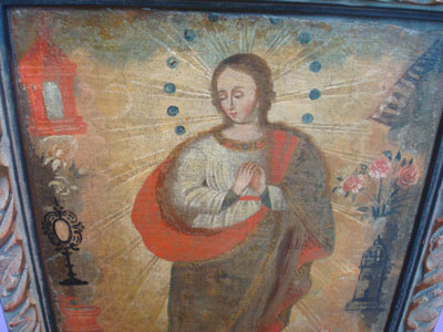 Mexican vintage devotional art, and vintage Mexican fine art, a beautiful oil painting of the Immaculate Conception, c. 1900. The image of Our Lady is extremely beautiful and serene. Closeup photo of Our Lady.