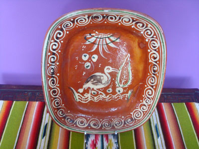 Mexican vintage pottery and ceramics, a beautiful Banderaware rectangular dish with a wonderful glazed border surrounding the figure of a heron or egret, Tonala or San Pedro Tlaquepaque, c. 1930's.