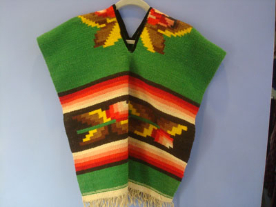 Mexican vintage textiles and sarapes, a beautiful child''s poncho with wonderful colors, c. 1950's.
