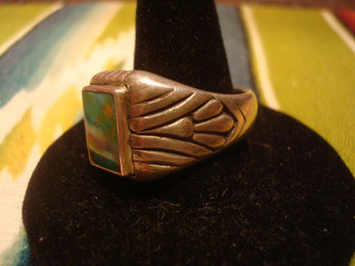 Native American Indian sterling silver jewelry, and Navajo sterling silver jewelry, a beautiful Navajo sterling silver ring with a beautiful turquoise stone, Arizona or New Mexico, c. 1940's. The silverwork is exceptional and the turquoise stone has a lovely matrix. Side view of the ring showing the lovely stamping.