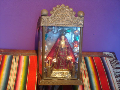Mexican vintage devotional art, a beautiful statue of Our Lady of the Soledad, the patroness of Oaxaca, in a wonderful tin and glass nicho, c. 1950's.