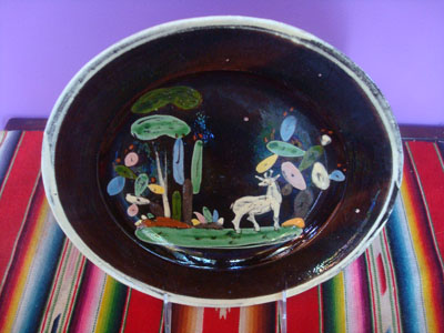 Mexican vintage pottery and ceramics, a lovely blackware pottery plate decorated with a wonderful deer, grazing amidst beautiful cacti, Tonala or San Pedro Tlaquepaque, c. 1930's.