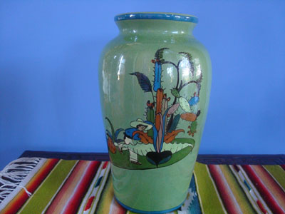 Mexican vintage pottery and ceramics, a lovely pottery vase with a beautiful green background and very fine and crisp artwork, Tonala or San Pedro Tlaquepaque, c. 1930's. The scenes decorating the vase depict Mexican village life of he time.