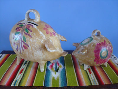 Mexican vintage folk art, a pair of wonderful pottery piggy banks, with beautiful patina and decorations, c. 1940's.