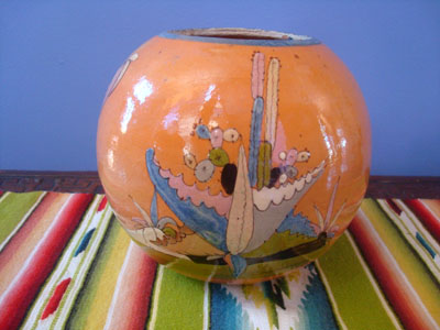 Mexican vintage pottery and ceramics, a beautiful pottery tecomate with a lovely tangerine background and very fine artwork, Tonala or San Pedro Tlaquepaque, c. 1930's. The artwork on the tecomate is very crisp and lovely.