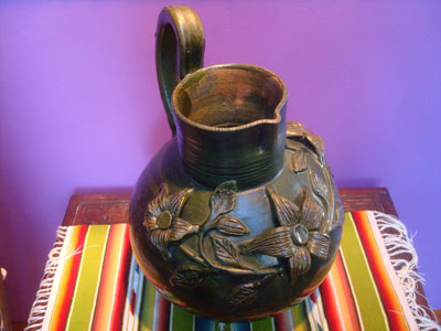 Mexican vintage pottery and ceramics, a beautiful pottery pitcher decorated with wonderful floral relief-work, Oaxaca, c. 1950's.
