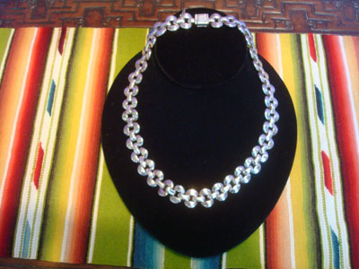 Mexican vintage sterling silver jewelry, and Taxco vintage sterling silver jewelry, a beautiful sterling silver necklace with a design resembling scallops on each side, Taxco, c. 1940's. The necklace is stamped 950 indicating a very high silver content.