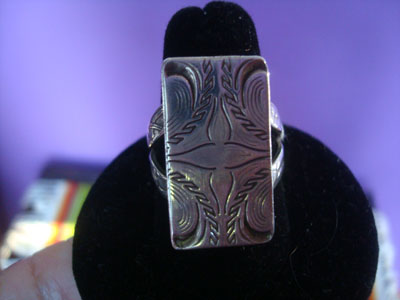 Native American Indian sterling silver jewelry, and Navajo vintage sterling silver jewelry, a wonderful sterling silver ring with fine stamping on the front and sides, Arizona or New Mexico, c. 1950's.