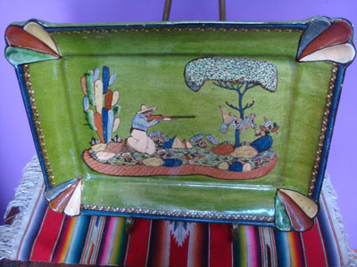 Mexican vintage pottery and ceramics, a beautiful rectangular pottery dish decorated with a finely painted hunting scene, Tonala or San Pedro Tlaquepaque, c. 1940.