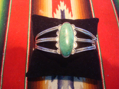 Native American Indian vintage sterling silver jewelry, and Navajo vintage sterling silver jewelry, a beautiful sterling silver bracelet with a wonderful turquoise stone and stampine, Arizona or New Mexico, c. 1940's.